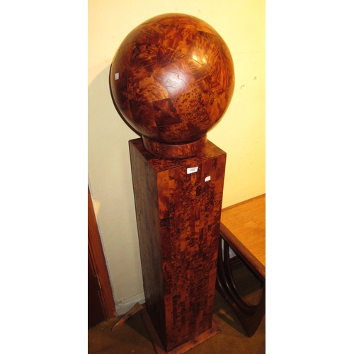 1162 - Large modern burr wood sculpture in the form of a ball mounted on a rectagular column, 143cm high