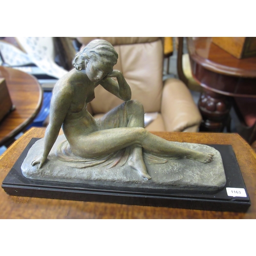 1163 - 20th Century patinated spelter figure of a seated female nude on a black marble plinth, 59 x 35cm