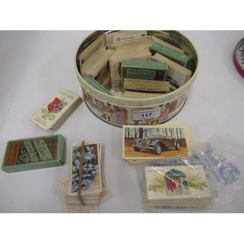 117 - Tin containing a collection of various early cigarette cards including John Players, Wills etc.