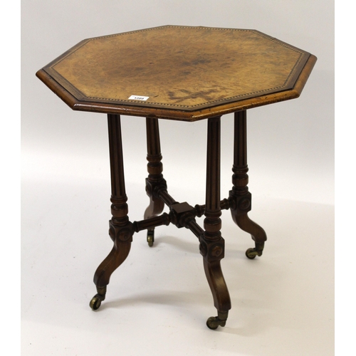 1209 - Small figured walnut octagonal occasional table on four tapering fluted supports with crossover stre... 