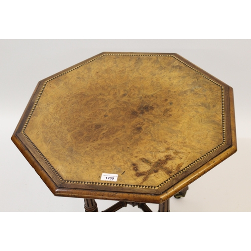 1209 - Small figured walnut octagonal occasional table on four tapering fluted supports with crossover stre... 