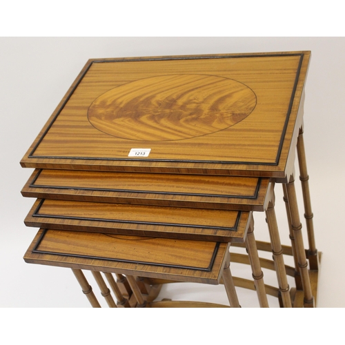 1213 - Nest of four rectangular satinwood occasional tables on slender turned supports with oval inlaid top... 