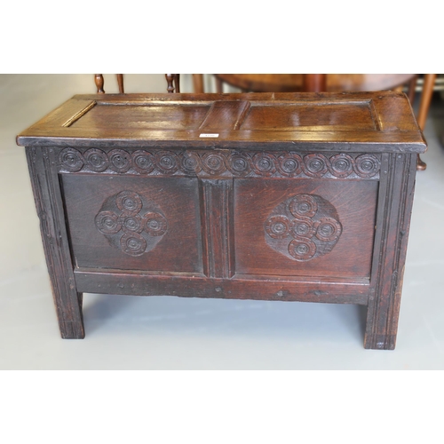 1216 - Small 17th Century oak coffer, the hinged two panel lid above a carved frieze and two panel front on... 