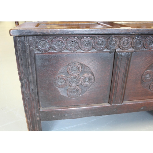 1216 - Small 17th Century oak coffer, the hinged two panel lid above a carved frieze and two panel front on... 