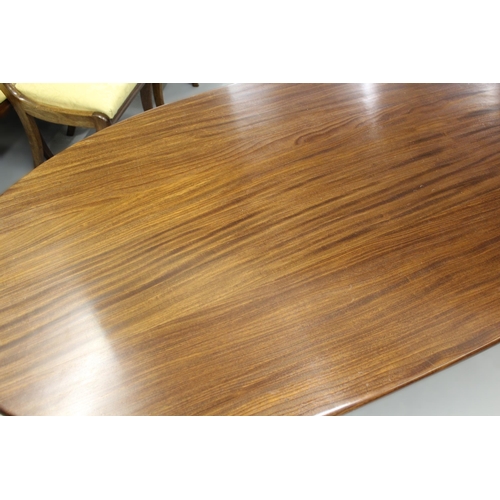 1222 - Mid 20th Century mahogany oval dining table on stylised outswept supports, 180 x 100cm approximately