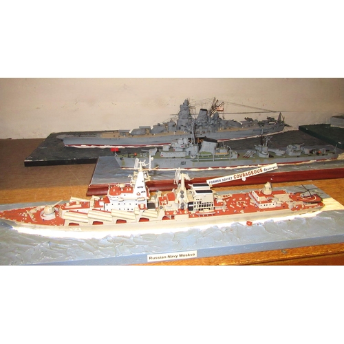 124 - Four large display models of World War II battleships, one with three ships and a display model of Y... 