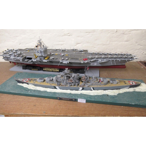 125 - Five large display models of World War II battleships and submarines and an aircraft carrier