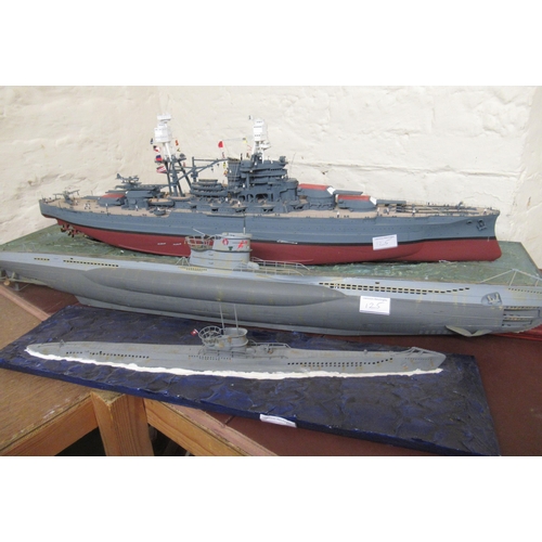 125 - Five large display models of World War II battleships and submarines and an aircraft carrier