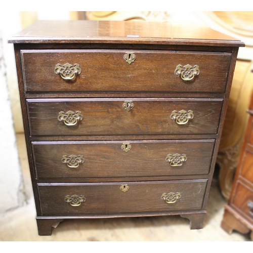 Reproduction oak chest of four graduated drawers with brass handles and bracket feet , 80cm wide