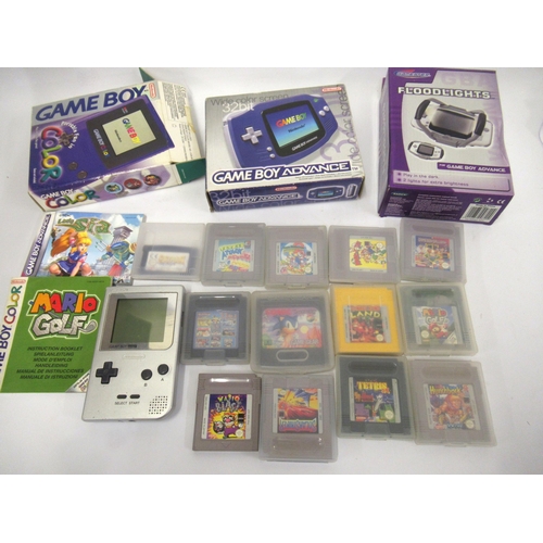 126 - Two boxed Nintendo Game Boy units, including a quantity of various cassette games