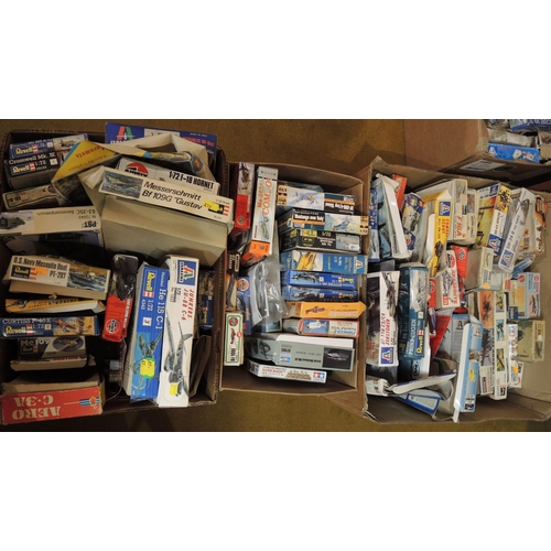 132 - Four boxes containing a large quantity of various boxed and bagged of model aircraft kits, including... 