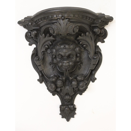 1442 - 19th Century carved and ebonised mask head wall bracket, 42cm high