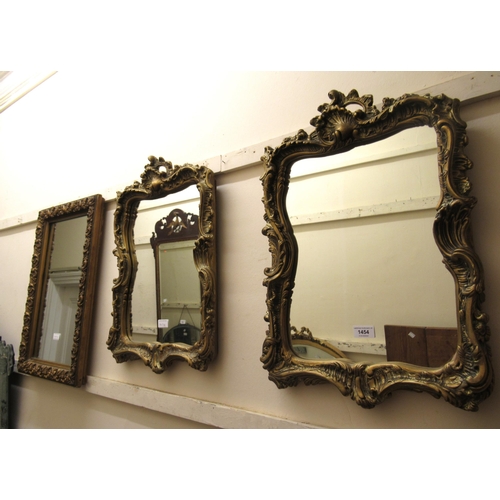 1454 - Pair of 20th century gilt framed rectangular wall mirrors, in rococo style, 58cm high x 40cm  wide, ... 