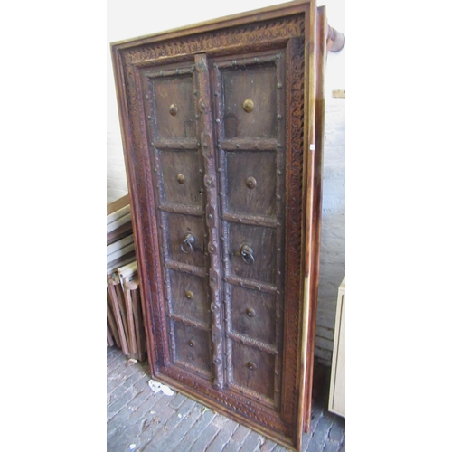 1457 - Large antique Indian hardwood and metal mounted panelled door adapted for use as a coffee table, in ... 