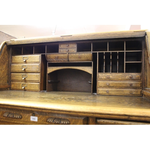 1468 - Good quality oak roll top tambour fronted desk enclosing a fitted interior of various shelves and dr... 