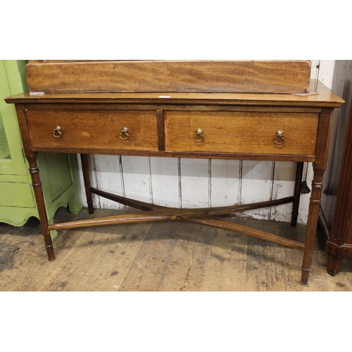 1491 - 20th Century mahogany two drawer side table, having brass drop handles with crossover stretcher , 76... 