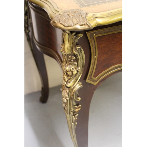 1502 - 20th Century Louis XV style writing table, having black leather gilt tooled inset top with ormolu mo... 