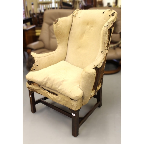 1504 - George III wingback armchair, with loose cushion, scroll arms and square chamfered front supports wi... 