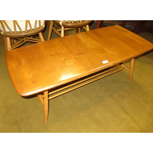 1514 - Ercol (unmarked) light ash coffee table, on splayed supports, with undertier, 36cm high x 104cm long... 