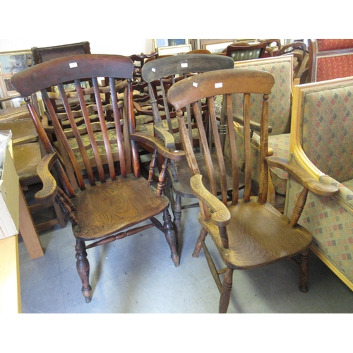 1517 - 19th Century beech and elm kitchen elbow chair with a slat back, together with a similar with spindl... 