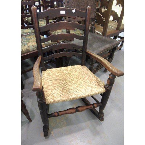 1517 - 19th Century beech and elm kitchen elbow chair with a slat back, together with a similar with spindl... 