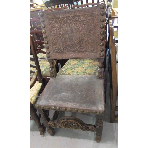 1519 - 17th Century oak side chair, the rectangular tooled and embossed studded leather back above a simila... 