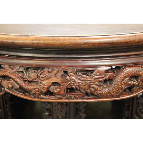 1532 - Good quality Chinese hardwood centre table with carved and pierced frieze, raised on a carved base d... 