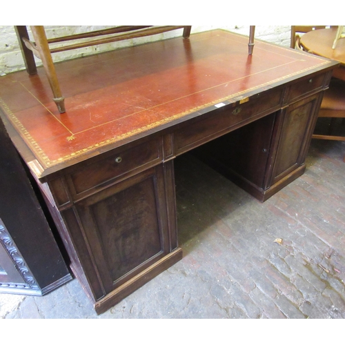 1540 - 19th Century mahogany partner's desk having an arrangement of nine drawers above panel doors enclosi... 