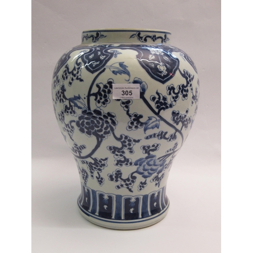 305 - Chinese porcelain baluster form temple jar with blue floral decoration, 33cm high