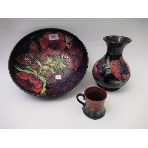 333 - Modern Moorcroft bowl in the Anemone pattern with dark blue ground, together with a similar baluster... 