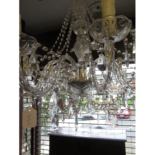 440 - Modern glass eight light electrolier with scroll shaped arms, baluster centre column and various dro... 