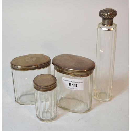 Four various silver mounted glass dressing table jars