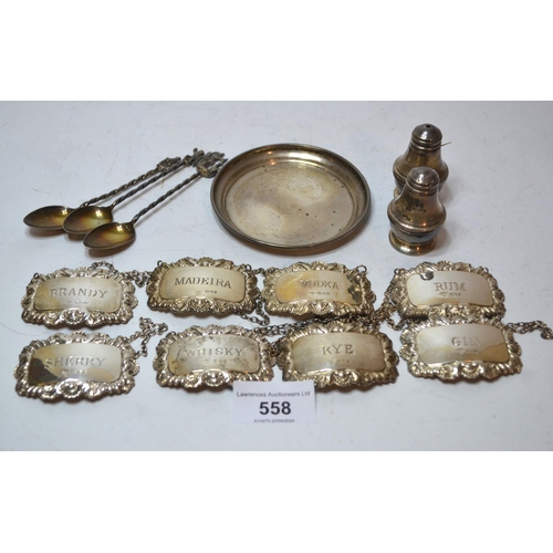 558 - Set of eight silver decanter labels, small silver dish, pair of conidments and three spoons