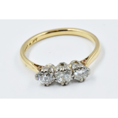 560 - 18ct Yellow gold ring set three diamonds, size K.5, 2.5g