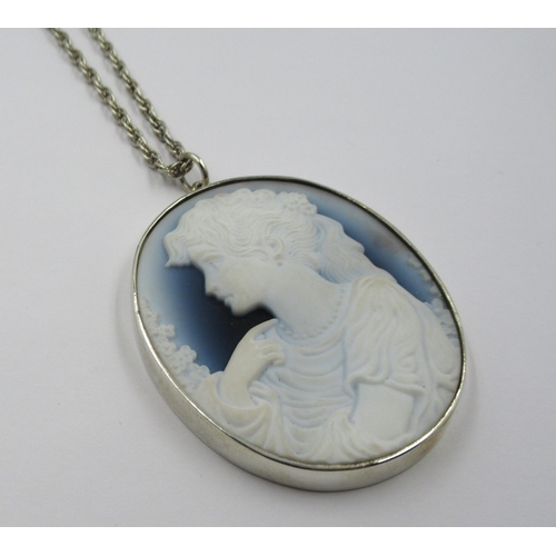 561 - Circular silver mounted glass portrait cameo pendant on a silver chain