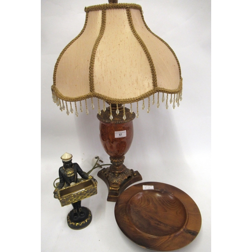 57 - Reproduction glass and composition table lamp, reproduction composition figure of a boy carrying a b... 