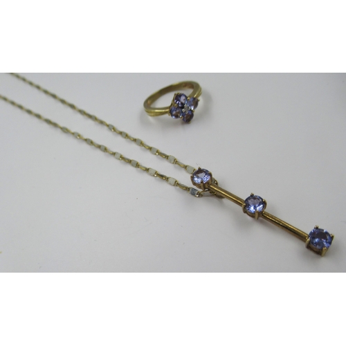 686 - 9ct Gold dress ring set four tanzanites, size J, together with a similar tanzanite set pendant neckl... 