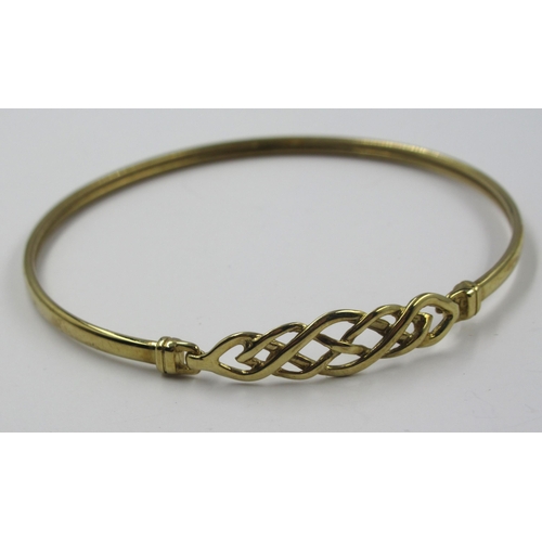 687 - Small 9ct gold Celtic knot design bangle, 3.5g