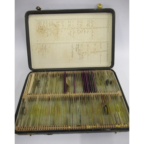 94 - Cased quantity of microscope slides