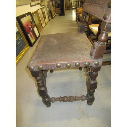 1519 - 17th Century oak side chair, the rectangular tooled and embossed studded leather back above a simila... 