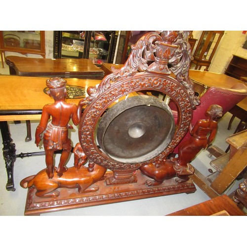 1521 - Very large Indonesian carved hardwood gong on stand, the central circular support with profuse all-o... 