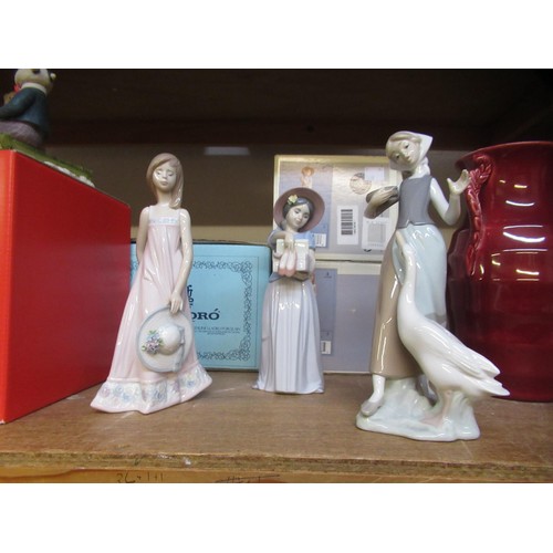 432 - Group of three various boxed Lladro figures