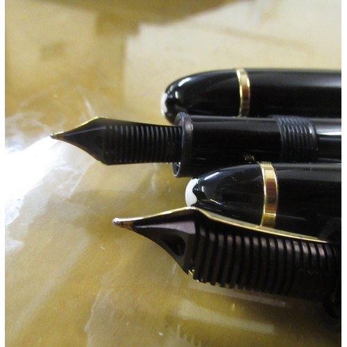 94A - Montblanc No. 149, two fountain pen set, one with an 18ct gold nib, the other with a 14ct gold nib