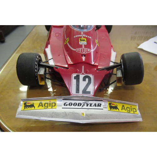 127 - Two mint boxed 1/18th scale die cast metal model racing cars of Lotus 49B by A Model and UT models o... 