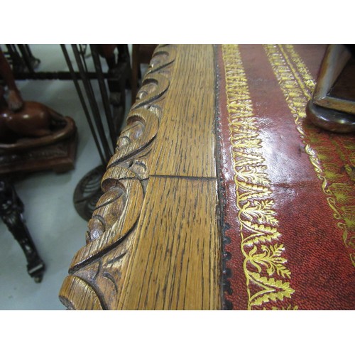 1522 - Fine oak twin pedestal partner's desk, the shaped red tooled leather inset top above shallow frieze ... 