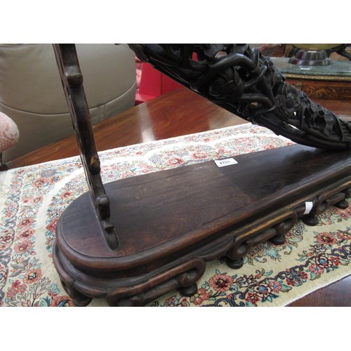 1524 - Pair of Chinese carved hardwood tusk form ornaments, each with a conforming carved hardwood stand, 4... 