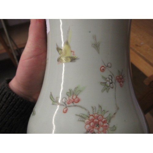 455 - Chinese porcelain baluster form vase with a flared rim decorated with birds and foliage on a pale gr... 