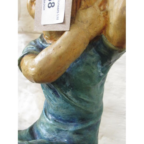 388 - Unusual Compton Pottery table lamp base, modelled as a seated child, circa 1920 with original label ... 