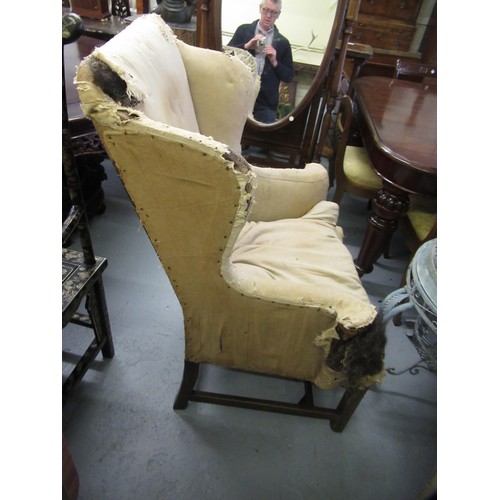 1504 - George III wingback armchair, with loose cushion, scroll arms and square chamfered front supports wi... 