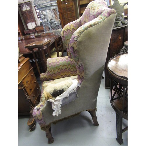 1503 - 19th Century wingback armchair, in Carolean style on shaped supports with crossover stretcher (for r... 